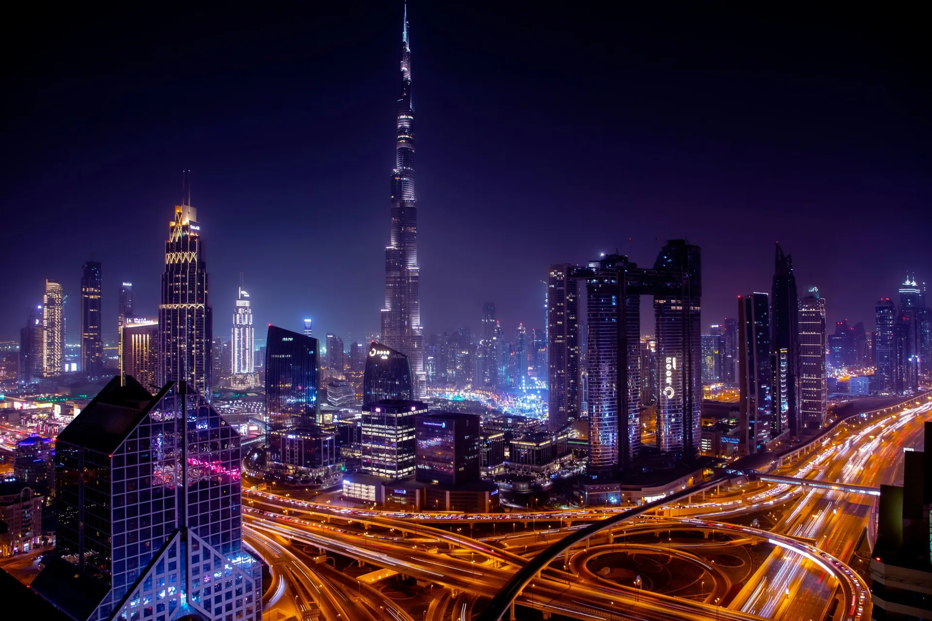 Dubai skyline at night with light trails