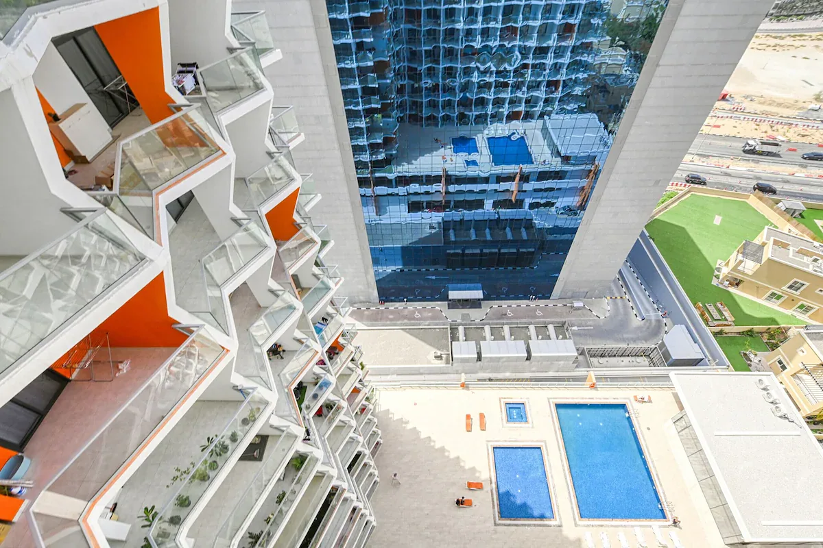 View looking down the tower's balconies to the pool deck and the road